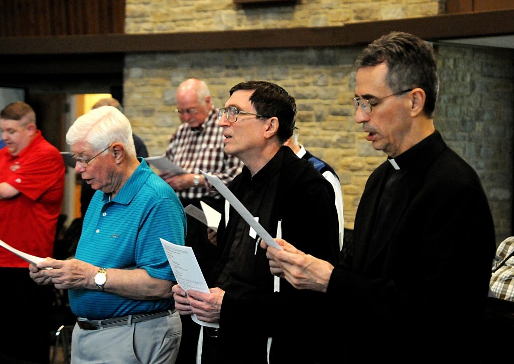Fathers Ken Baker, Joe Kindel and Tom Nevels sing the opening hymn during vespers prior to the Archdiocese of Cincinnati's Ordination Anniversary Dinner at the Bergamo Center in Beavercreek, Ohio on Monday, May 6. Priests from the ordination classes of 1959, '69, '79 and '94 were recognized for their years of service during the annual celebration, which also featured a dinner. (CT Photo/David A. Moodie)