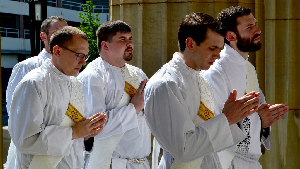 Front Row, Deacon Andrew Hess, Deacon Ambrose Dobrozsi; 2nd Row: Deacon Jeff Stegbauer, Deacon Mark Bredestege entering the Cathedral of St. Peter in Chains. (CT Photo/Greg Hartman)