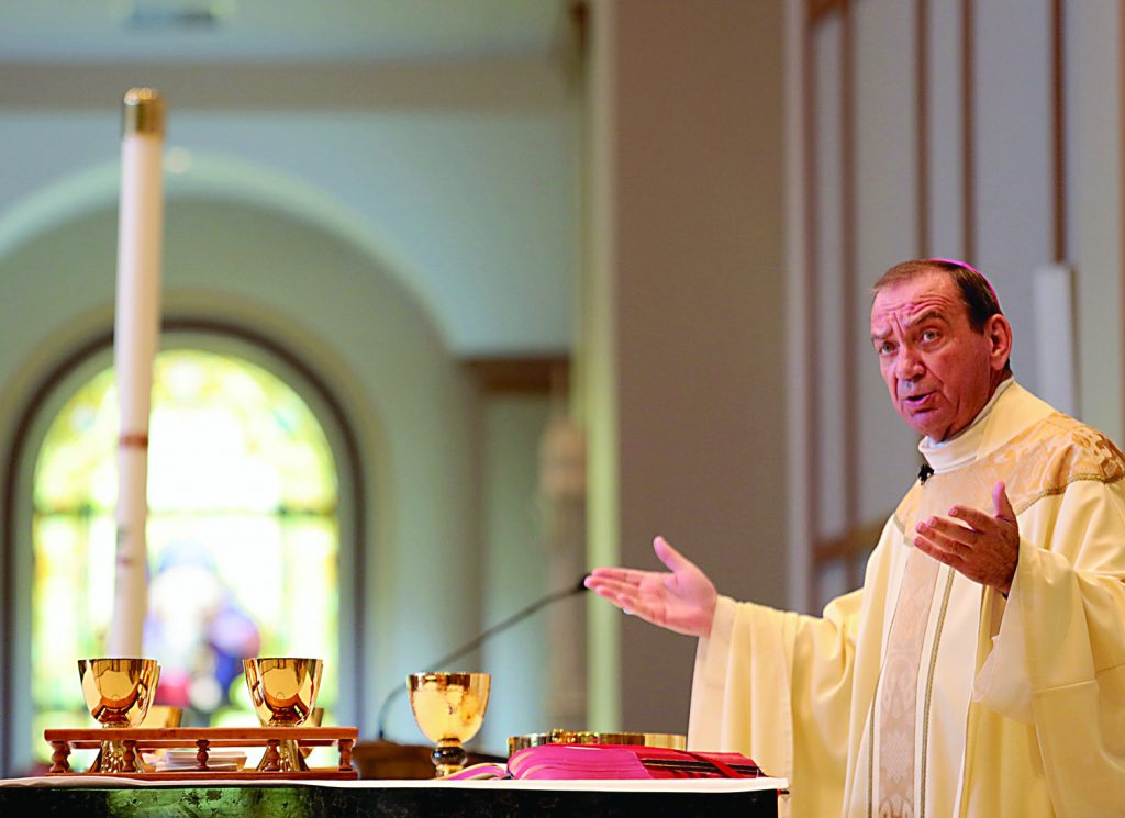 Archbishop Dennis Schnurr prepares the Holy Eucharist during the dedication of St. John the Baptist Church in Harrison Saturday, June 1, 2019. (CT Photo/E.L. Hubbard)