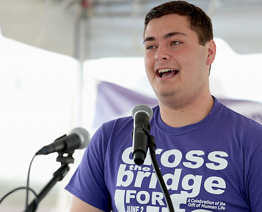 Carson Rayhill, with Students for Life at Xavier University, speaks during the Cross the Bridge for Life in Newport, Ky. Sunday, June 2, 2019. (CT Photo/E.L. Hubbard)