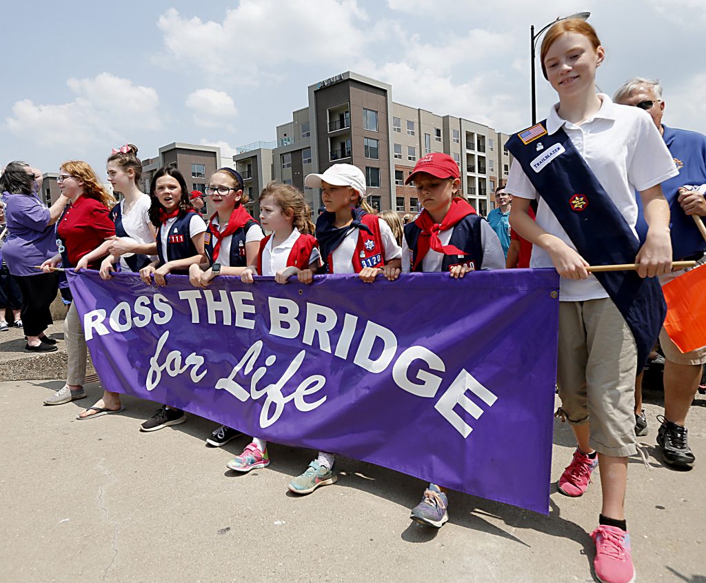 American Heritage Girls carry the banner during the Cross the Bridge for Life in Newport, Ky. Sunday, June 2, 2019. (CT Photo/E.L. Hubbard)