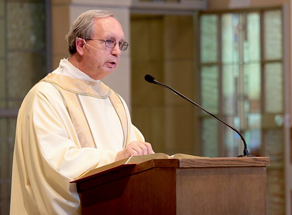 Deacon Donald Meyer proclaims the Gospel during the dedication of St. John the Baptist Church in Harrison Saturday, June 1, 2019. (CT Photo/E.L. Hubbard)