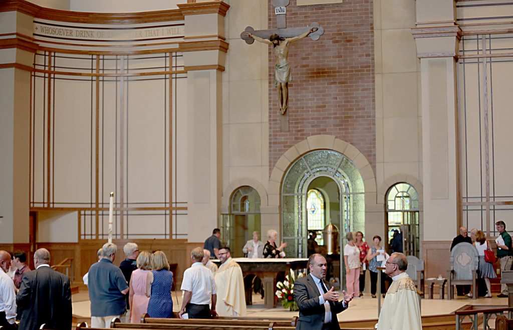 People linger in the new church after the dedication of St. John the Baptist Church in Harrison Saturday, June 1, 2019. (CT Photo/E.L. Hubbard)