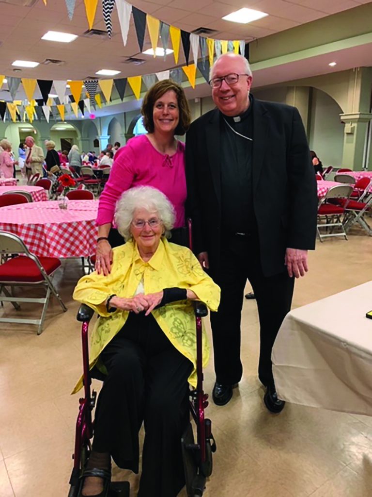 Bishop Joseph Binzer poses for a picture with St. Antoninus parishioners Karen Cromer and her mother Jean Boehme. (Courtesy Photo)
