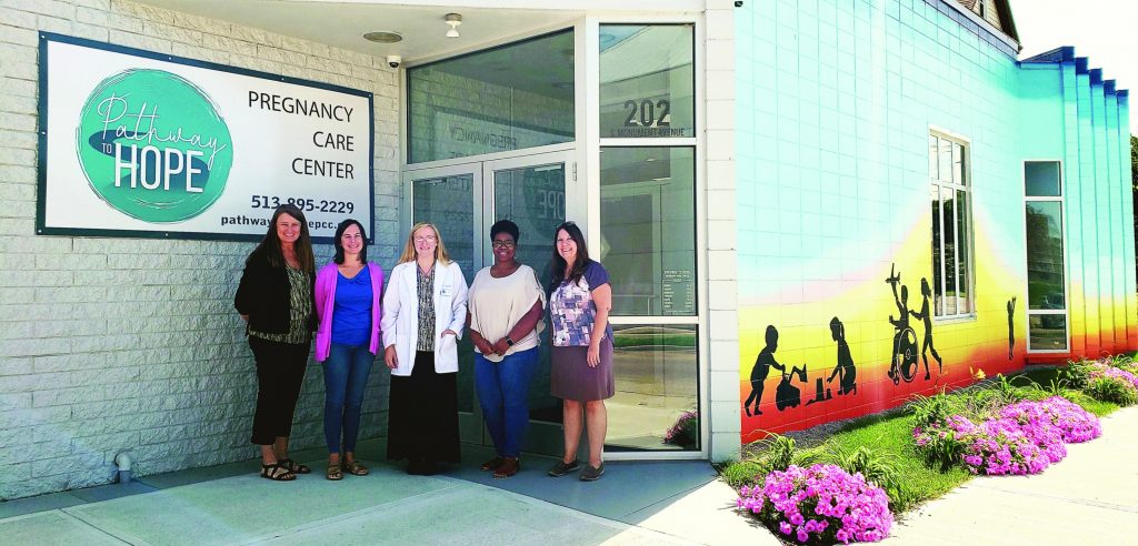 Lori Haskell, Leah Miley, Erin Shock, Jennifer Weddington and Nina Solomon outside Pathway to Hope, a pregnancy care center in Hamilton.