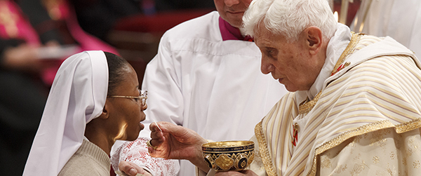 File photo of Pope distributing Communion during Mass in St. Peter's Basilica