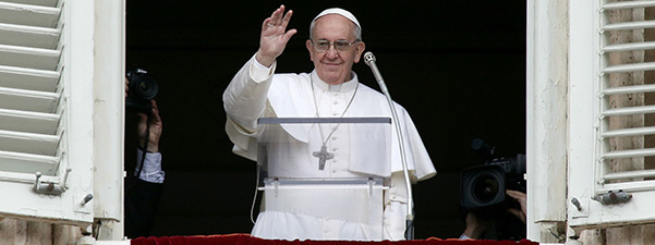 Newly elected Pope Francis waves to crowd during Angelus at Vatican