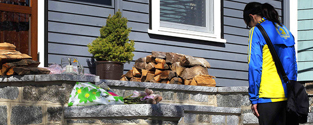 Boston Marathon runner leaves flowers on doorstep of home of 8-year-old Martin Richard, who was killed in blast