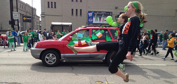 Members of the Erickson Academy of Irish Dance leap throughout the streets of Cincinnati in the 2013 St Patrick's Day Parade.