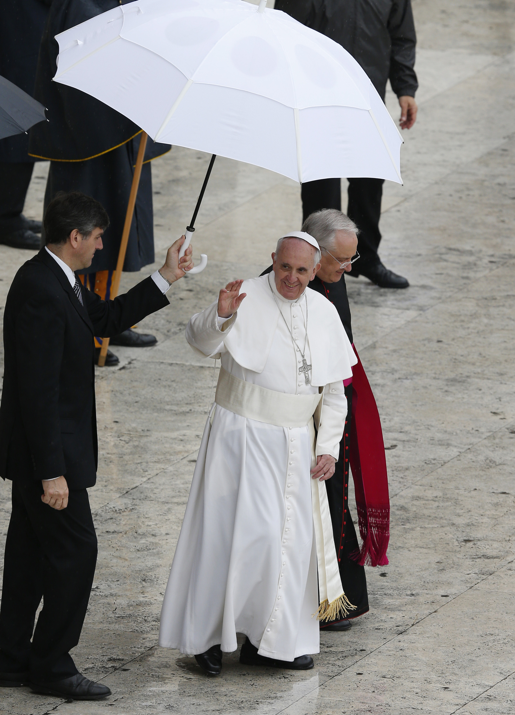 Pope Francis waves from the popemobile at end of canonization Mass at Vatican