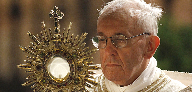 Pope Francis carries monstrance during observance of Corpus Christi feast