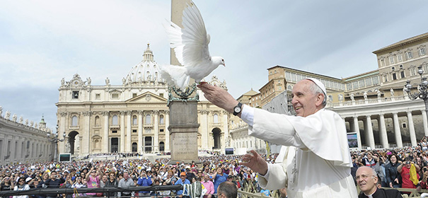 Pope Francis holds dove before his weekly audience at the Vatican