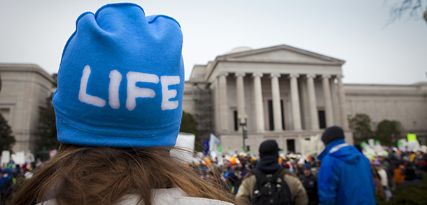 Minnesota woman stands in front of Supreme Court building during March for Life in Washington