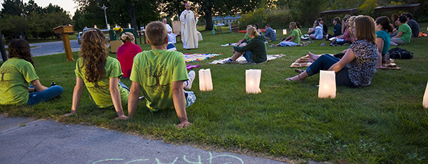 Green Bay Auxiliary Bishop Robert Morneau delivers his homily during an outdoor "Mass on the Grass" at the Richard Mauthe Center on the University of Wisconsin at Green Bay campus Sept. 11. The evening service was the Newman Center's fall welcome event, inviting students to worship together and to learn about Catholic campus ministry. (CNS photo/Sam Lucero, The Compass) (Sept. 12, 2011)