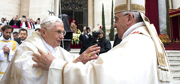 Retired Pope Benedict XVI embraces Pope Francis before the canonization Mass for Sts. John XXIII and John Paul II in St. Peter's Square at the Vatican April 27. (CNS photo/L'Osservatore Romano via Reuters) (April 27, 2014) See SAINTS-MASS and SAINTS-COLOR April 27, 2014.