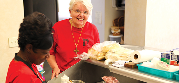 Sister of Notre Dame de Namur Judy Tensing works with a Power Inspires Progress trainee. (Courtesy Photo)