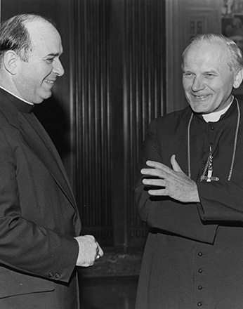 Distinguished Visitor Cardinal Karol Wojtyla of Poland, is welcomed by then-Archbishop of Cincinnati Joseph L. Bernardin at St. Peter in Chains cathedral on Sept. 2, 1976. Cardinal Wojtyla visited Cincinnati to thank Archbishop Bernardin for his visit to Poland. (CT File Photo)