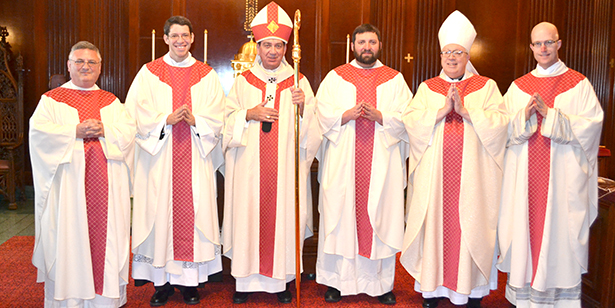 From left, Seminary Rector Father Benedict O'Cinnsealaigh, newly ordained Father James Riehle, Archbishop of Cincinnati Dennis M. Schnurr, newly ordained Father Brian Phelps, Auxiliary Bishop Joseph R. Binzer and Vocations Director Father Kyle Schnipple pose for a photo immediately following ordination May 17 at the Cathedral of St. Peter in Chains. (CT Photo/John Stegeman)