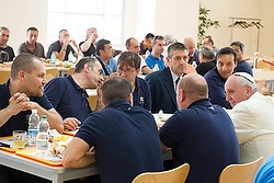 Pope Francis talks with Vatican workers during a surprise visit to the Vatican cafeteria July 25. (CNS photo/L'Osservatore Romano via Reuters) (July 25, 2014) See CAFETERIA-POPE July 25, 2014.