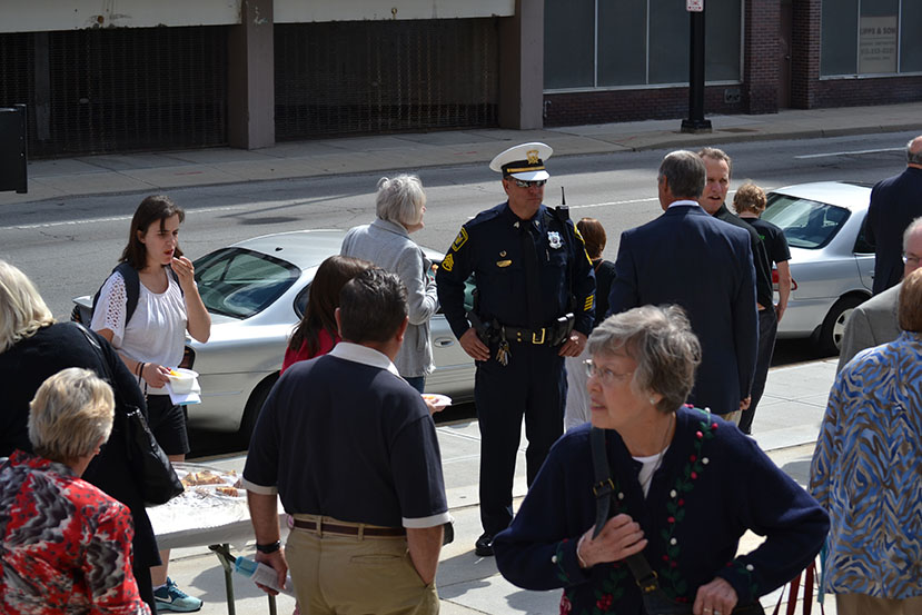 A police officer and others gather for a reception following the Sept. 14 Blue Mass at the Cathedral of St. Peter in Chains. (CT Photo/John Stegeman)