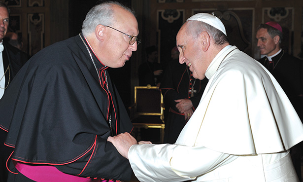 Auxiliary Bishop of Cincinnati Joseph R. Binzer, left, meets with Pope Francis Sept. 18 at the Vatican. Bishop Binzer was present to attend a conference for new bishops. (L’OSSERVATORE ROMANO PHOTO) 