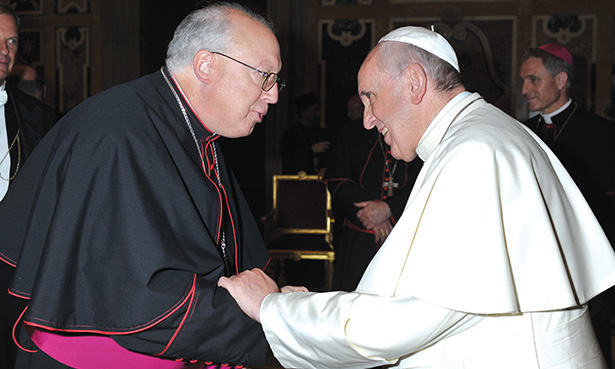 Auxiliary Bishop of Cincinnati Joseph R. Binzer, left, meets with Pope Francis Sept. 18 at the Vatican. Bishop Binzer was present to attend a conference for new bishops. (L’OSSERVATORE ROMANO PHOTO)