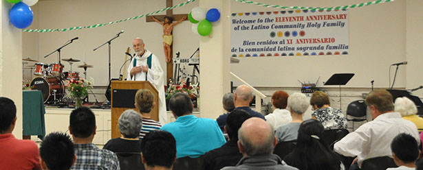 Father Len Wenke celebrates the 11th anniversary Mass for the Holy Family Latino community.