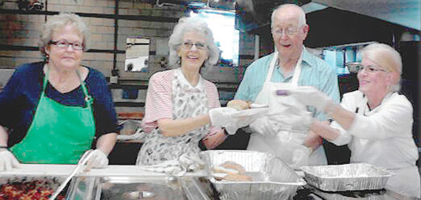 Volunteers at the Walnut Hills Soup Kitchen prepare to serve a meal. (CT Photo/Eileen Connelly, OSU)