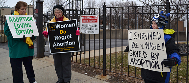 Participants hold signs as part of the Cincinnati "mini-March for Life." (CT Photo/John Stegeman)