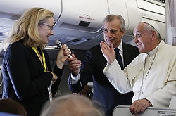 Pope Francis answers questions from journalists aboard his flight from Manila, Philippines, to Rome Jan. 19. (CNS photo/Paul Haring) 