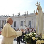 Pope Francis prays in front of a statue of Our Lady of Fatima during his general audience in St. Peter's Square at the Vatican May 13. The statue, which was present for the May 13 feast of Our Lady of Fatima, is a copy of the original in Fatima, Portugal. (CNS photo/L'Osservatore Romano, pool) 
