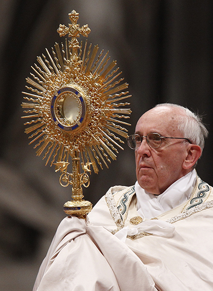 Pope Francis leads the Benediction following eucharistic adoration in St. Peter's Basilica at the Vatican June 2, 2013. (CNS photo/Paul Haring) 