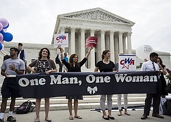 Supporters of traditional marriage between a man and a woman rally in front of the U.S. Supreme Court in Washington June 26, shortly before the justices handed down a 5-4 ruling that states must license same-sex marriages and must recognize same-sex marriages performed in other states. (CNS photo/Joshua Roberts, Reuters) 