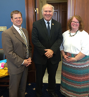 Tony Stieritz, director of the Archdiocese of Cincinnati Social Action Office, left, and Pam Long Regional Director for the Social Action Office, right, pose for a photo with Congressman Steve Chabot. (Courtesy Photo)