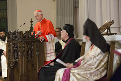 Cardinal Donald W. Wuerl of Washington offers a reflection during a Sept. 9 ecumenical prayer service at St. Joseph Church on Capitol Hill opening the In Defense of Christians Leadership Convention in Washington. At right is Bishop Gregory Mansour of the Eparchy of St. Maron of Brooklyn, N.Y., and Archbishop Oshagan Choloyan, the prelate of the Armenian Apostolic Church of the Eastern United States. (CNS photo/Jaclyn Lippelmann, Catholic Standard)