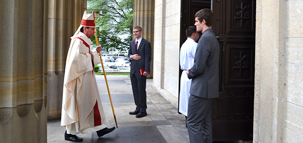 Archbishop of Cincinnati Dennis M. Schnurr processes into the Cathedral of St. Peter in Chains prior to the 2015 ordination Mass last May. The main door of the Cathedral, seen here, will be sealed Sunday, Nov. 1 in preparation for the Extraordinary Jubilee of Mercy. (CT Photo/John Stegeman)