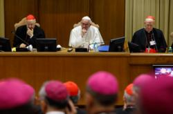 Pope Francis leads the opening session of the Synod of Bishops on the family at the Vatican Oct. 5. Also pictured are Cardinals Lorenzo Baldisseri, general secretary of the Synod of Bishops, left, and Peter Erdo of Esztergom-Budapest, Hungary, relator for the synod. (CNS photo/Paul Haring) 