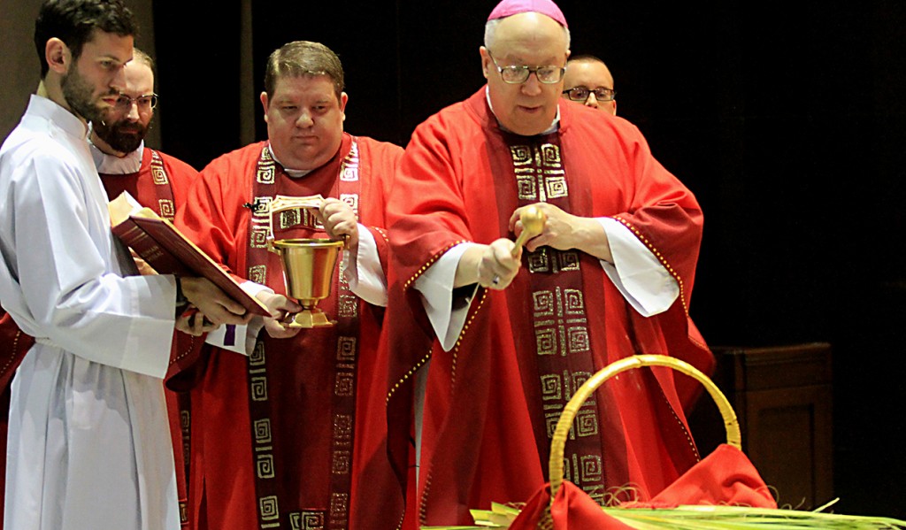 The Most Reverend Joseph R. Binzer, Auxiliary bishop of Cincinnati, blesses the palm leaves at the Cathedral of Saint Peter in Chains in Cincinnati on Palm Sunday, March 20, 2016. (CT Photo/E.L. Hubbard)