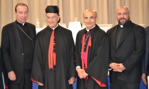 Key speakers at the One Church of Mercy conference held at Annunciation of the Blessed Virgin Mary in Clifton July 1 included, from left, Archbishop of Cincinnati Dennis M. Schnurr; Patriarch of the Maronite Church, Mar Bechara Peter Cardinal Rai of Lebanon; Bishop A. Elias Zaiden, Bishop of the Maronite Eparchy of Our Lady of Lebanon, Los Angeles; and Fr. George Hajj, pastor of St. Anthony of Padua Maronite Parish in Cincinnati. (CT Photo/Steve Trosley)