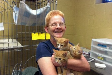 Sister Eileen holds three of the kittens she fostered and socialized. (Courtesy Photo)