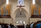 Archbishop Dennis Schnurr prepares the Eucharist during the St. Mary of the Assumption Mass of Dedication in Springboro Sunday, August 14, 2016. (CT Photo/E.L. Hubbard)