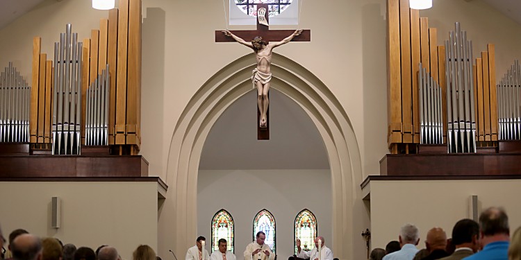 Archbishop Dennis Schnurr prepares the Eucharist during the St. Mary of the Assumption Mass of Dedication in Springboro Sunday, August 14, 2016. (CT Photo/E.L. Hubbard)