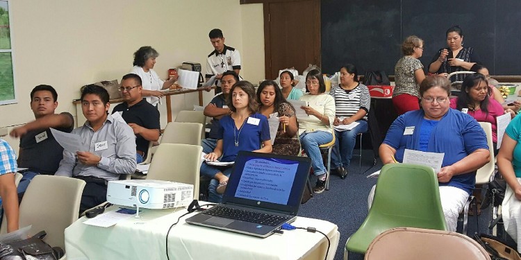 Hispanic adults students are shown attending a Catholic Social Teaching formation program recently. (Courtesy Photo)