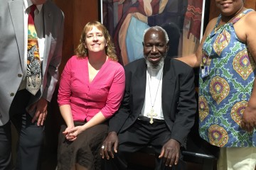 Bishop Emeritus Paride Taban poses with staff members from the archdiocesan Mission Office. Pictured with him from left are Mike Gable, Teresa Phillips and Melonise Knight. (Courtesy Photo)