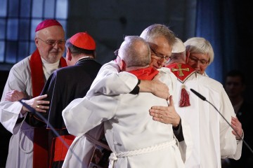 The Rev. Martin Junge, general secretary of the Lutheran World Federation, embraces Bishop Munib Younan of the Evangelical Lutheran Church, president of the Lutheran World Federation, front center, during an ecumenical prayer service at the Lutheran cathedral in Lund, Sweden, Oct. 31. At right, Pope Francis embraces Archbishop Antje Jackelen, primate of the Lutheran Church in Sweden. At left is Bishop Anders Arborelius of Stockholm and Cardinal Kurt Koch, president of the Pontifical Council for Promoting Christian Unity. (CNS photo/Paul Haring)