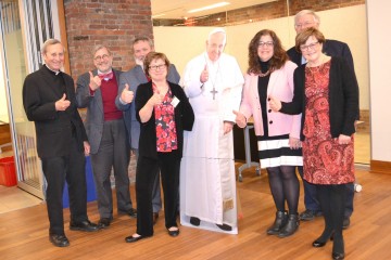 Recipients of the Guild’s Communicator of the Year award pose with a cutout of Pope Francis. From left: Father. Bob Hater, Dan Andriacco, Michael Pitman, Elizabeth Bookser Barkley,, Marianne Zeleznik, John Keiswetter, Patricia Frey.