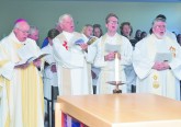 Bishop Joseph R. Binzer sings with Fathers Dave Brinkmoller, Ethan Moore and Steve DeSantos. (CT Photo/Jeff Unroe)