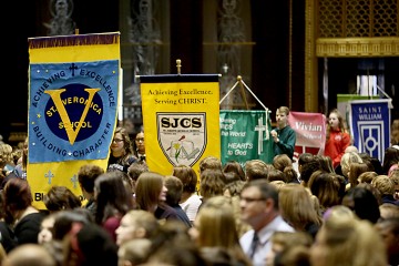 Students carry in their respective school banners during the Catholic Schools Week Mass at the Cathedral of Saint Peter in Chains in Cincinnati Tuesday, Jan. 31, 2017. (CT Photo/E.L. Hubbard)