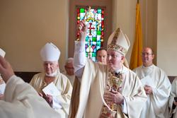 Bishop Mitchell T. Rozanski blesses the congregation at St. Michael's Cathedral in Springfield, Mass., with holy water Aug. 12 during his installation as the ninth bishop of the diocese. (CNS photo/ Paul McMullen, Catholic Review)