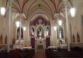 After the climb, the faithful sit and pray in silence inside Holy Cross Immaculata Church. (Greg Hartman/CT Photo)
